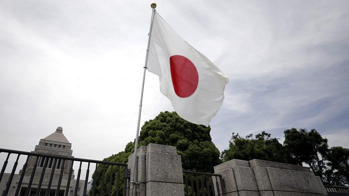 A Japanese national flag flies outside the National Diet building in Tokyo