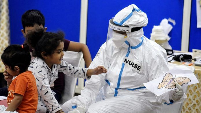 Representational image of children with healthcare workers at a Covid care centre | Photo: ANI