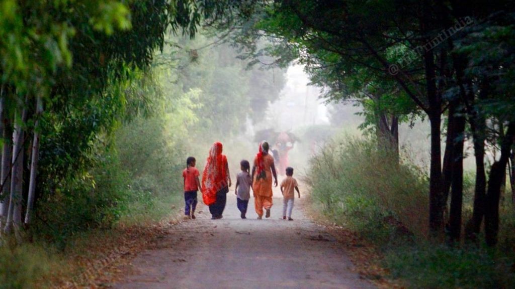 Young children accompany their mothers on a stroll in Chunni Kalan village of Mohali, Punjab | Praveen Jain | ThePrint