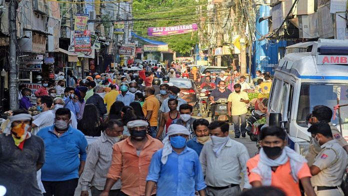 People crowd a weekly market which reopened after the COVID-19 lockdown, in New Delhi | ANI