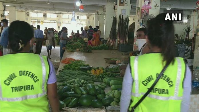 Civil defence volunteers deployed in Agartala markets to ensure social distancing norms are followed | Twitter | @ANI