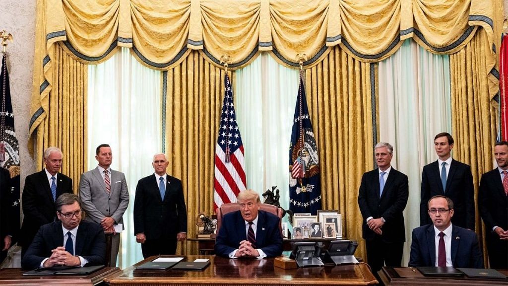 Donald Trump participates in a signing ceremony and meeting with the President of Serbia Aleksandar Vucic (left) and the Prime Minister of Kosovo Avdullah Hoti (right) in the Oval Office of the White House on September 4, 2020 | Pool/Getty images via Bloomberg