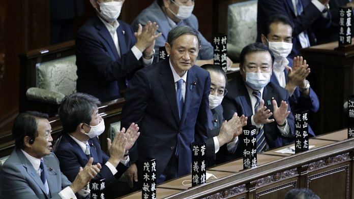 Yoshihide Suga, president of the Liberal Democratic Party (LDP), center, receives a round of applause after being elected as Japan's prime minister during an extraordinary session at the lower house of parliament in Tokyo, Japan, on Wednesday, Sept. 16, 2020 | Kiyoshi Ota | Bloomberg