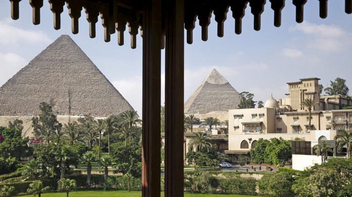 File photo of the ancient pyramids of Giza stand beyond the gardens of the Mena House hotel in Cairo