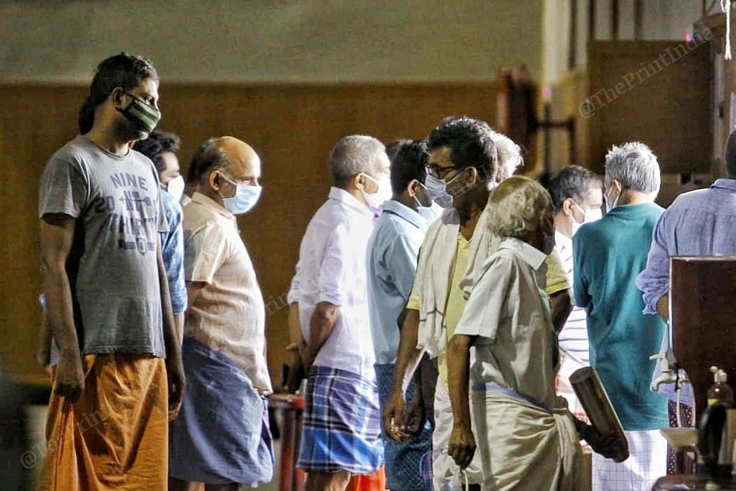 Recovered patients stand in queue to leave the centre | Photi: Praveen Jain | ThePrint