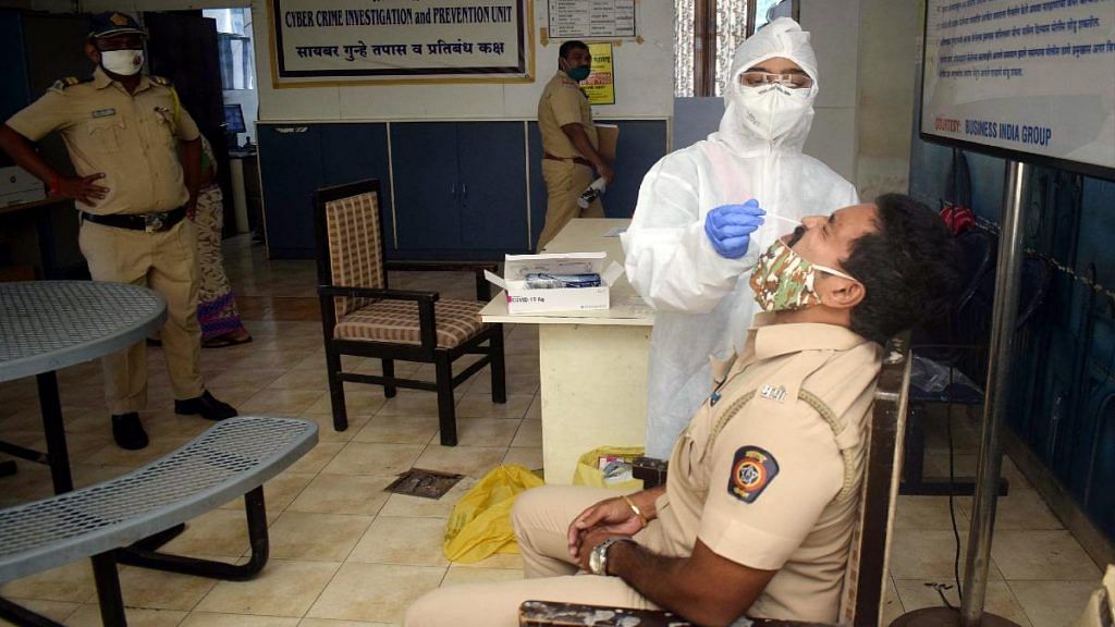 A BMC staffer conducts a Covid test at a Mumbai Police station | Representational image | ANI