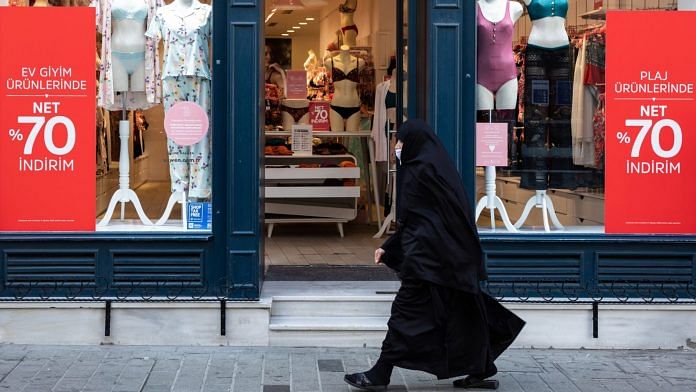 A woman wearing a hijab passes a store in Istanbul, Turkey. | Representational Image | Photographer: Kerem Uzel | Bloomberg