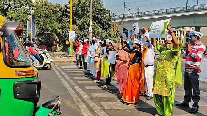 AAP MLA Raghav Chadha and volunteers at an intersection in New Delhi during 