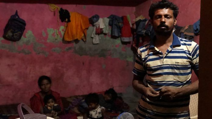 Sandeep Yadav, 32, a migrant labourer from Bihar, with his wife Rekha and three daughters at the room in Noida where they live | Jyoti Yadav | ThePrint