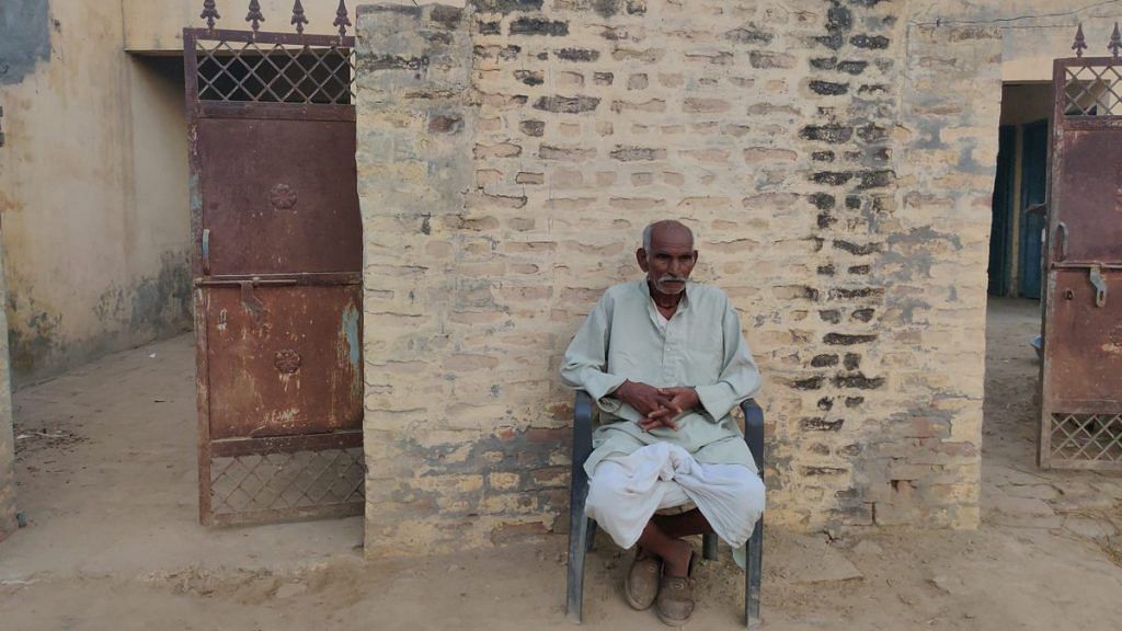 An old Dalit man sits outside his rebuilt house in Mirchpur | Photo: Jyoti Yadav | ThePrint