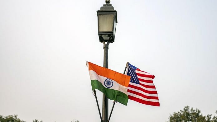 The national flags of India and US hang from a lamppost in New Delhi