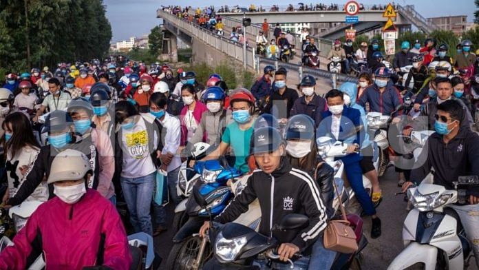 Workers make their way to the factories in Van Trung Industrial Park in Bac Giang Province | Bloomberg