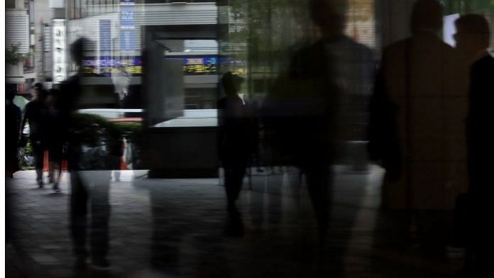 Pedestrians walk along a street in Tokyo, Japan | representational image| Kiyoshi Ota | Bloomberg