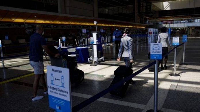 Passengers walk past thermal imaging cameras at Los Angeles International Airport (LAX) | Representational image | Patrick T. Fallon | Bloomberg