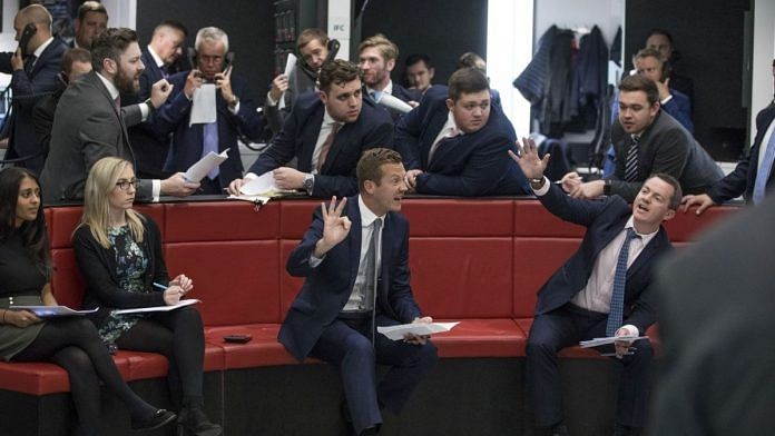 Traders react on the trading floor of the open outcry pit at the London Metal Exchange Ltd. (LME) in London, U.K. on Wednesday, Sept. 25, 2019. The LME doubled the length of its closing open-outcry trading sessions after a trial in the zinc market boosted trading volumes, according to people familiar with the matter.