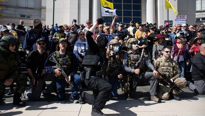 Demonstrators in 'tactica gear' at Michigan Supreme Court building during a Second Amendment March in Lansing, Michigan, U.S., on Thursday, Sept. 17, 2020 | Representational image | Emily Elconin | Bloomberg