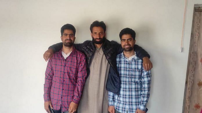Twins Gowhar (left) and Shakir (right) with their father Bashir Bhat at their home in Batpora, Baramulla | By special arrangement