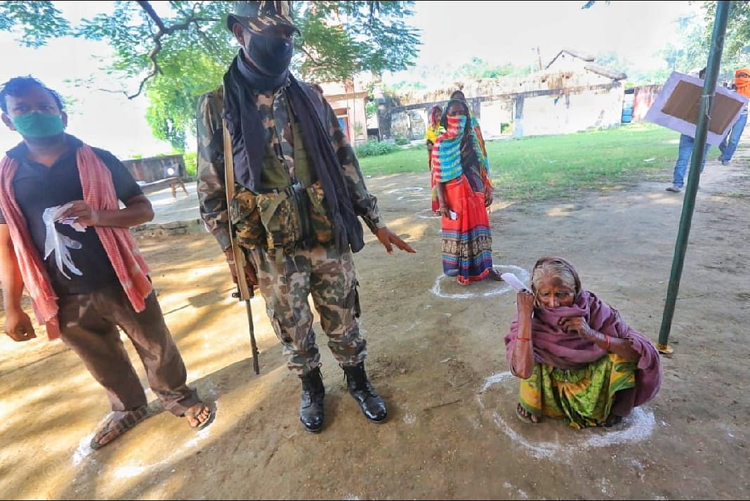 Army personnel stand guarding the polling booth in Belhori village | Praveen Jain | ThePrint