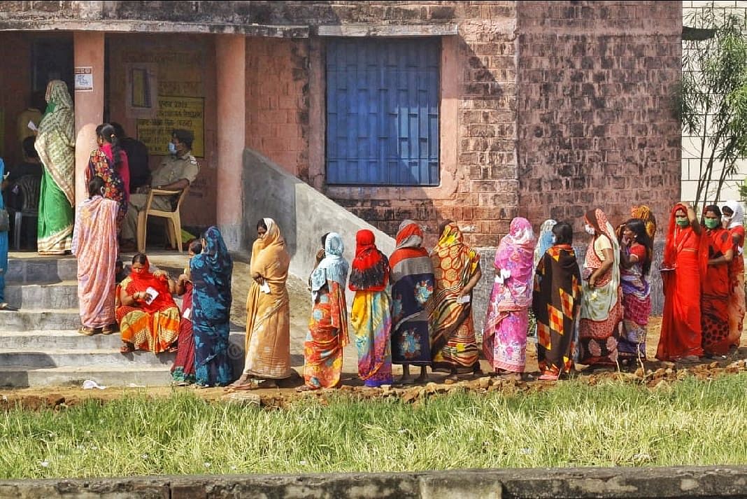 Women voters waiting to cast their votes in the first phase of Bihar elections in Sundarpur village | Praveen Jain | ThePrint | 