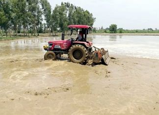 Representational image. | A file photo of a farmer plowing his fields with a tractor in Jalandhar. | Photo: ANI