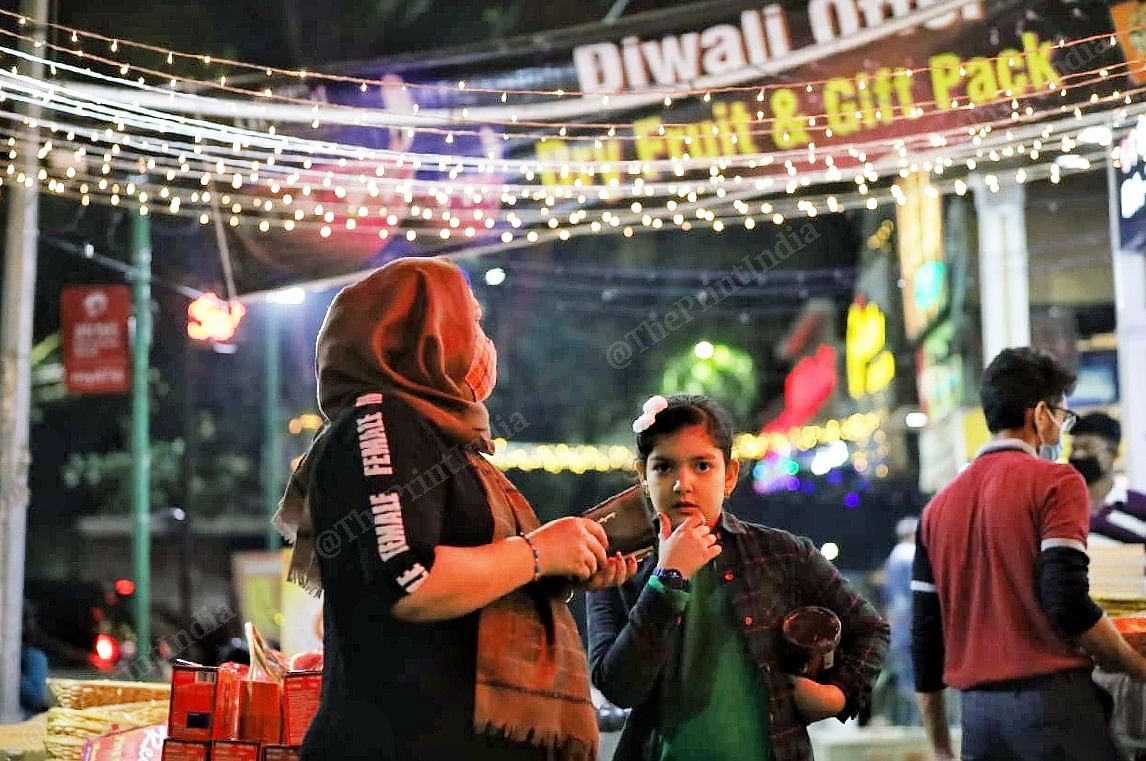 A mother daughter duo buys Diwali goodies in Amar Colony market | Photo: Manisha Mondal | ThePrint