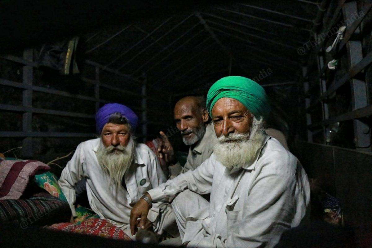Farmers rest after dinner | Photo: Manisha Mondal | ThePrint
