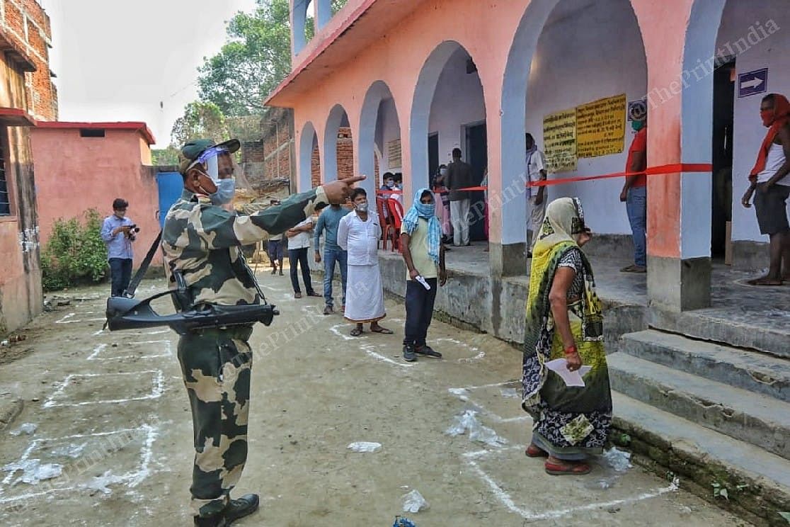 A BSF personnel at a polling booth in Folding Station Veterinary Ground | Praveen Jain | ThePrint