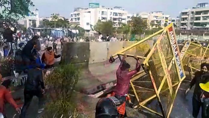 Farmers from Punjab remove barricades while pushing into Haryana, at Ambala, Thursday | ANI