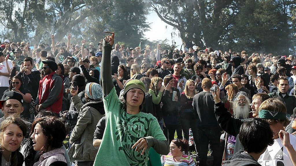 A cloud of smoke rests over the heads of a group of people during a 420 Day celebration on "Hippie Hill" in Golden Gate Park April 20, 2010 in San Francisco | Justin Sullivan | Getty Images via Bloomberg