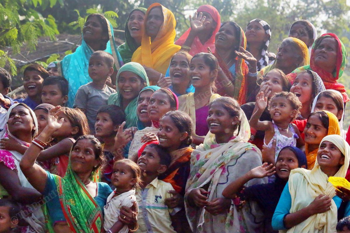 Women of villages look at the sky that saw many helicopters flying in Bihar election | Photo: Praveen Jain | ThePrint