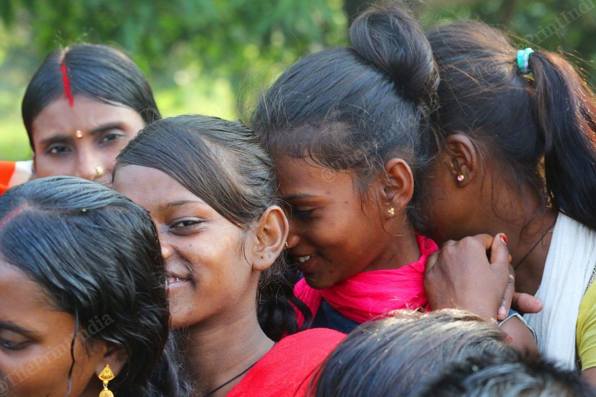 Girls try to hide from the camera during the election campaigning | Photo: Praveen Jain | ThePrint