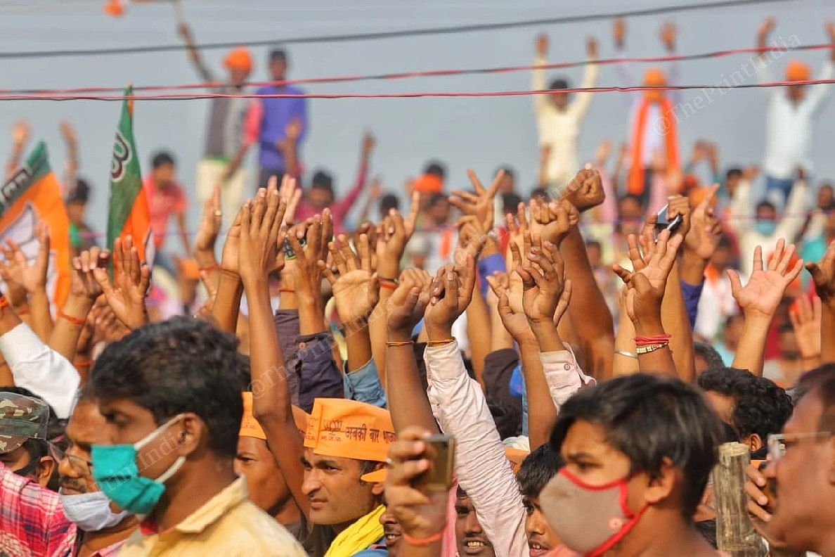 Supoters waving at the crowd of Yogi Adityanath election rally in Darbanga | Praveen Jain | ThePrint