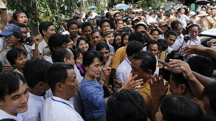 File photo of Myanmar State Counsellor Aung San Suu Kyi with supporters | Common