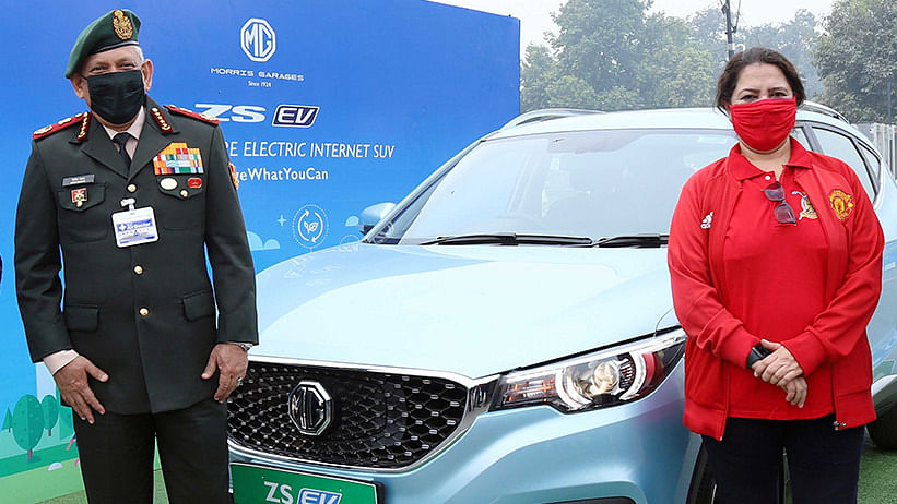 Chief of Defence Staff Gen. Bipin Rawat (left) and BJP MP Meenakshi Lekhi with an MG electric vehicle in New Delhi | Photo: Twitter | @MGMotorIn
