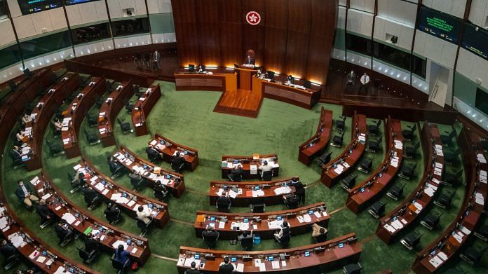 Seats left vacant by pro-democracy lawmakers that resigned en masse inside the Legislative Council in Hong Kong on 12 November | Photo via Bloomberg