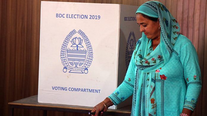 A woman casts her vote during Block Development Council election at Nagrota in 2019