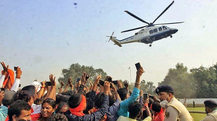 BJP supporters wave at Yogi Adityanath's helicopter in Darbhanga district of Bihar | Praveen Jain | ThePrint