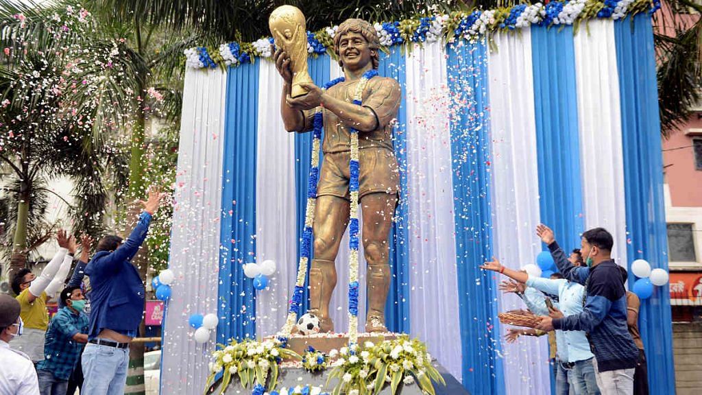 West Bengal minister Sujit Bose leads a tribute to Diego Maradona at the legend's statue in Kolkata Thursday | Photo: ANI