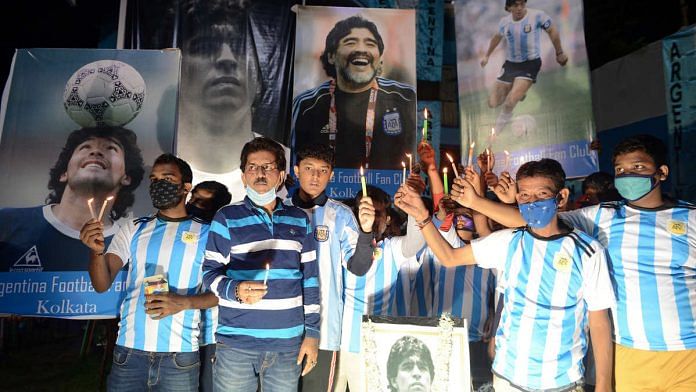 Fans in Kolkata organise a candle march to honour Argentine football legend Diego Maradona, who died Wednesday | Photo: ANI
