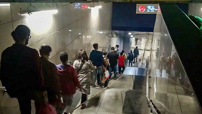 Passengers stand in a long queue at Rajiv Chowk Metro Station on 8 November | PTI Photo