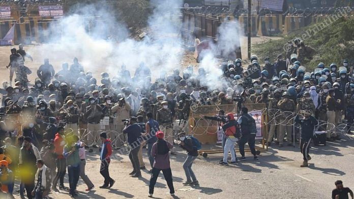 Delhi Police use tear gas on protesting farmers at Singhu border Friday | Photo: Manisha Mondal | ThePrint