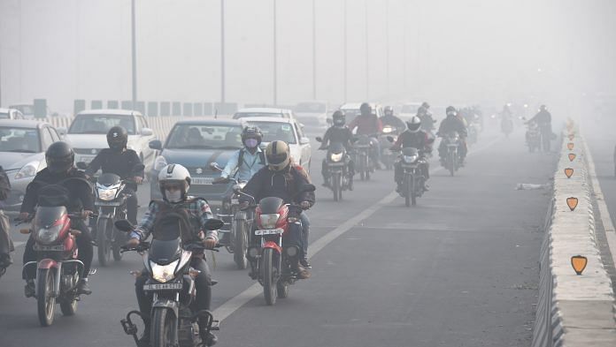 Vehicles ply amid low visibility due to smog, in New Delhi on 10 November