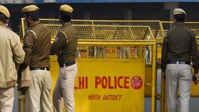 File photo | Four Delhi Policemen stand guard near a barricade in North Delhi | Twitter