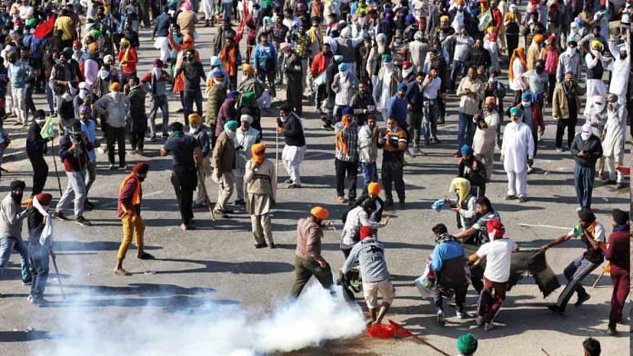 Delhi Police fire tear gas shells at protesting farmers as they try to cross the border on 27 November 2020 | Photo: Manisha Mondal | ThePrint