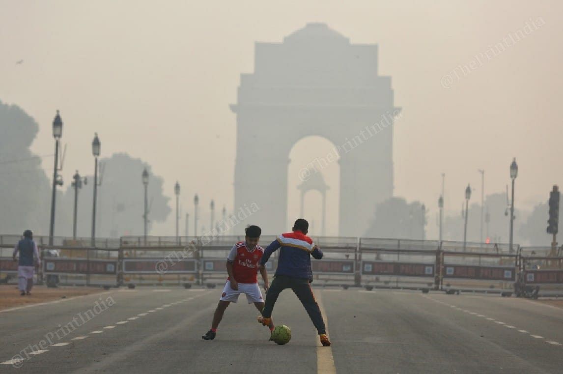 People seen playing near the India Gate even as the city's air quality dipped | Photo: Suraj Singh Bisht | ThePrint