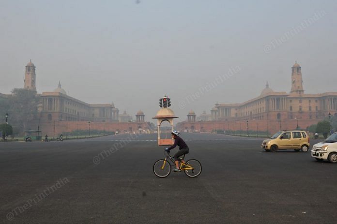 The air quality in several parts of Delhi fell in the 'poor' and 'severe' categories. Seen here is a cyclist near Rashtrapati Bhavan | Photo: Suraj Singh Bisht | ThePrint