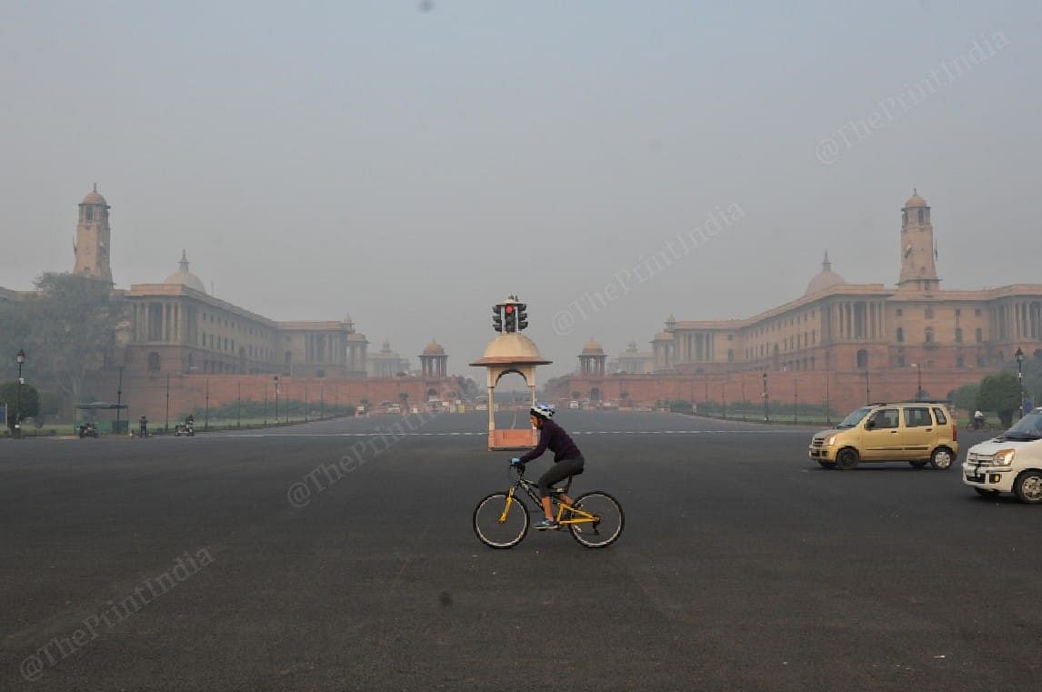 The air quality in several parts of Delhi fell in the 'poor' and 'severe' categories. Seen here is a cyclist near Rashtrapati Bhavan | Photo: Suraj Singh Bisht | ThePrint