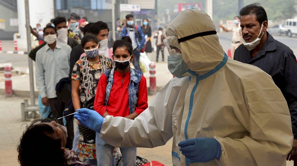 A health worker conducts Covid-19 rapid antigen test at Anand Vihar Bus Terminal on Wednesday, Nov. 4, 2020. | PTI