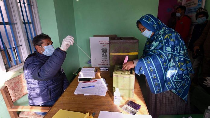 File image of a woman voting during the District Development Council polls in Jammu and Kashmir | Representational image: PTI