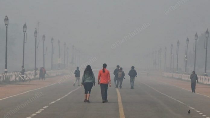 Joggers near India Gate amid rising air pollution in the national capital Sunday | Photo: Suraj Singh Bisht | ThePrint